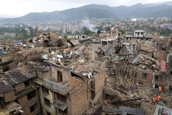 Rescue workers take part in the rescue operation where several houses have collapsed at Vhaktapur district in Nepal 27 April 2015. The death toll from this weekend's earthquake in Nepal is now at 4,138, reports the country's Interior Ministry. EPA/ABIR ABDULLAH